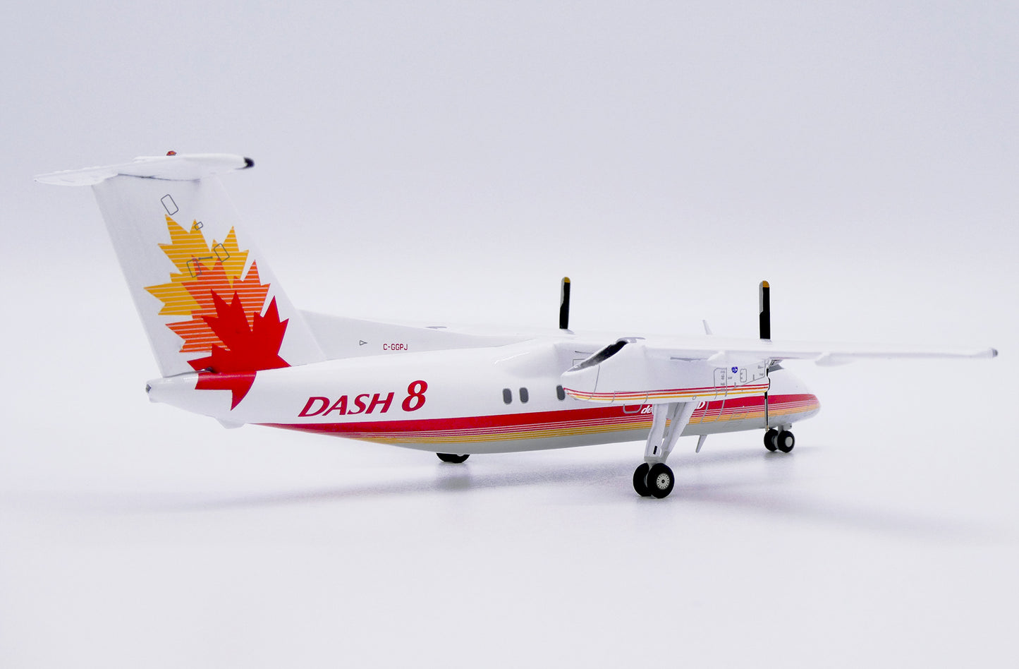 JC WINGS DASH 8-Q100 HOUSE COLOURS REG: C-GGPJ