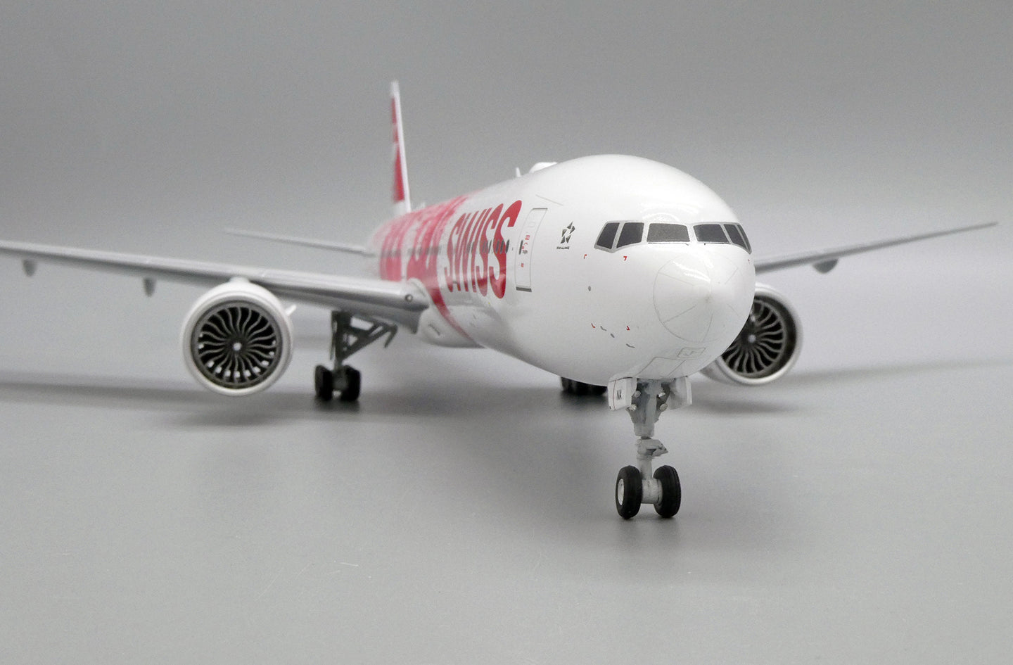 JC WINGS B777-300ER SWISS "FACES OF SWISS" REG: HB-JNA