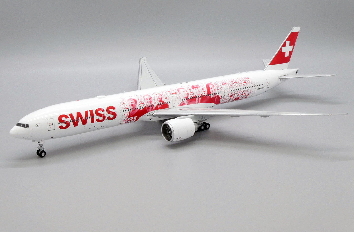 JC WINGS B777-300ER SWISS "FACES OF SWISS" REG: HB-JNA