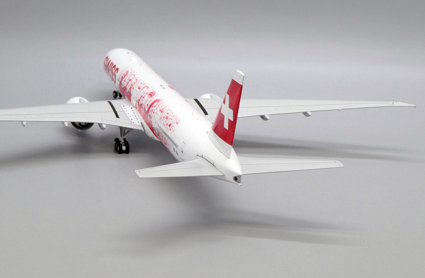 JC WINGS B777-300ER SWISS "FACES OF SWISS" REG: HB-JNA