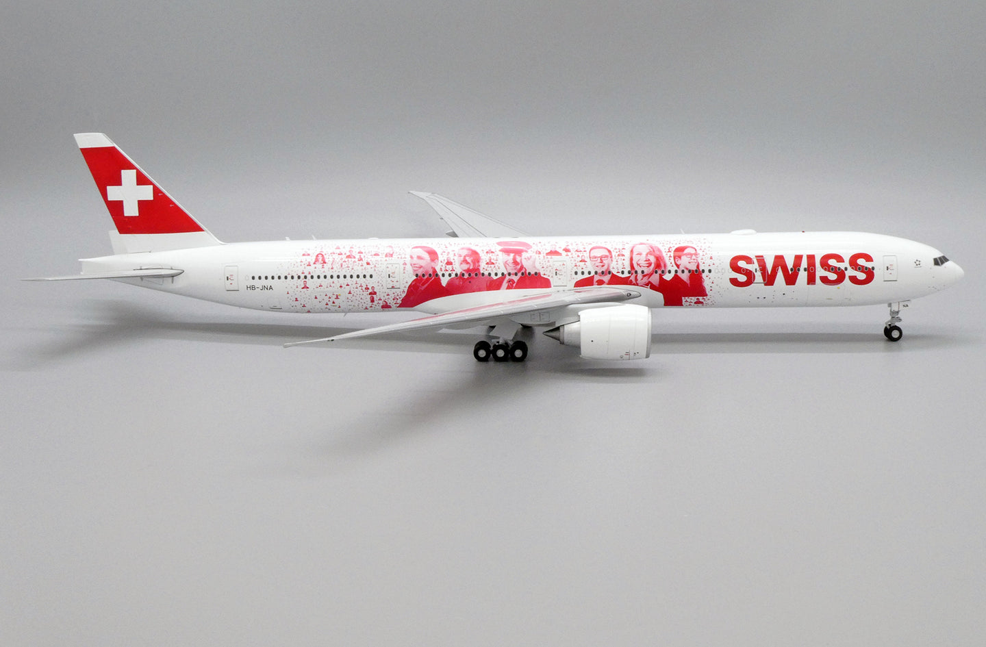 JC WINGS B777-300ER SWISS "FACES OF SWISS" REG: HB-JNA