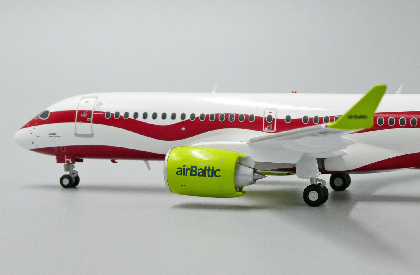 JC WINGS A220 AIR BALTIC "LATVIA 100TH LIVERY" REG: YL-CSL