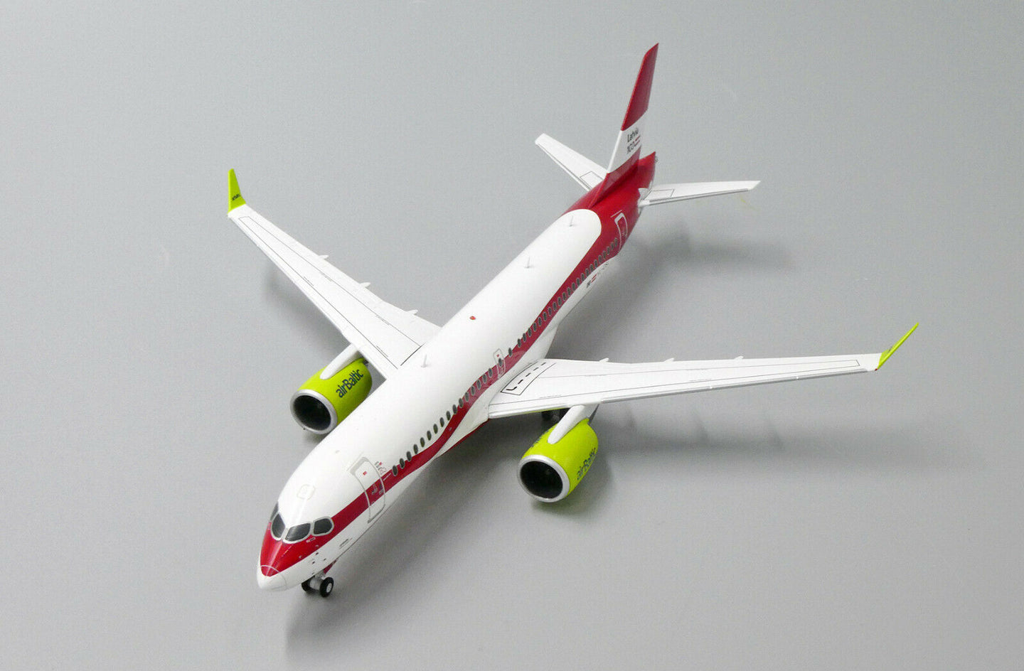 JC WINGS A220 AIR BALTIC "LATVIA 100TH LIVERY" REG: YL-CSL