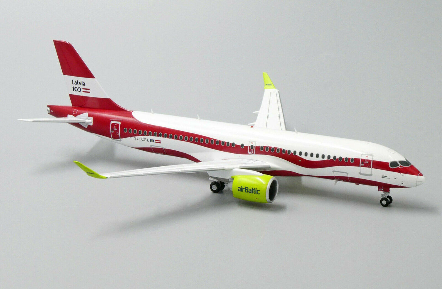 JC WINGS A220 AIR BALTIC "LATVIA 100TH LIVERY" REG: YL-CSL