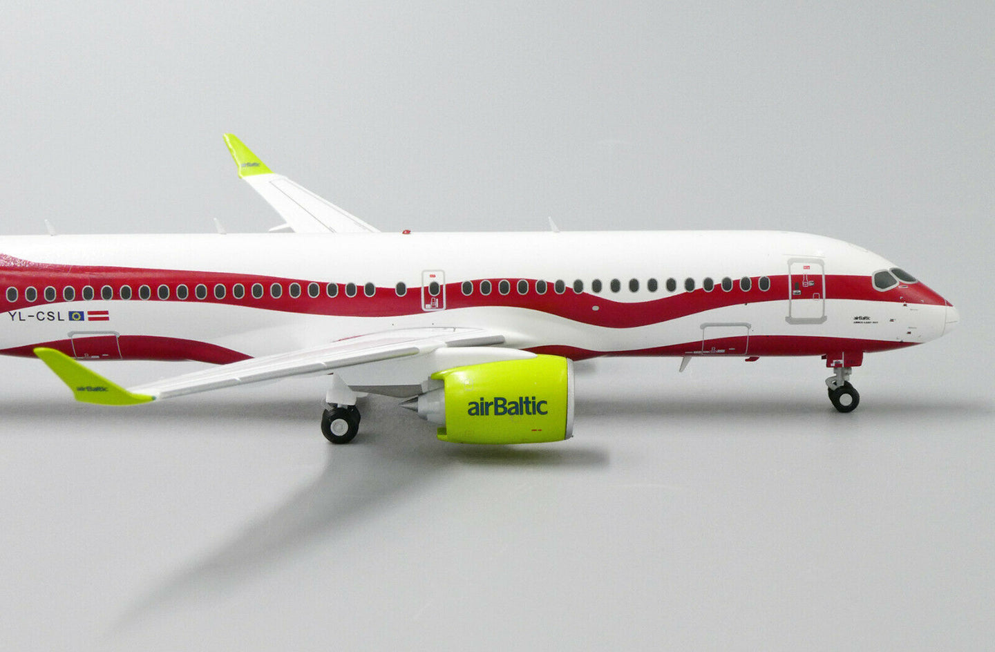 JC WINGS A220 AIR BALTIC "LATVIA 100TH LIVERY" REG: YL-CSL