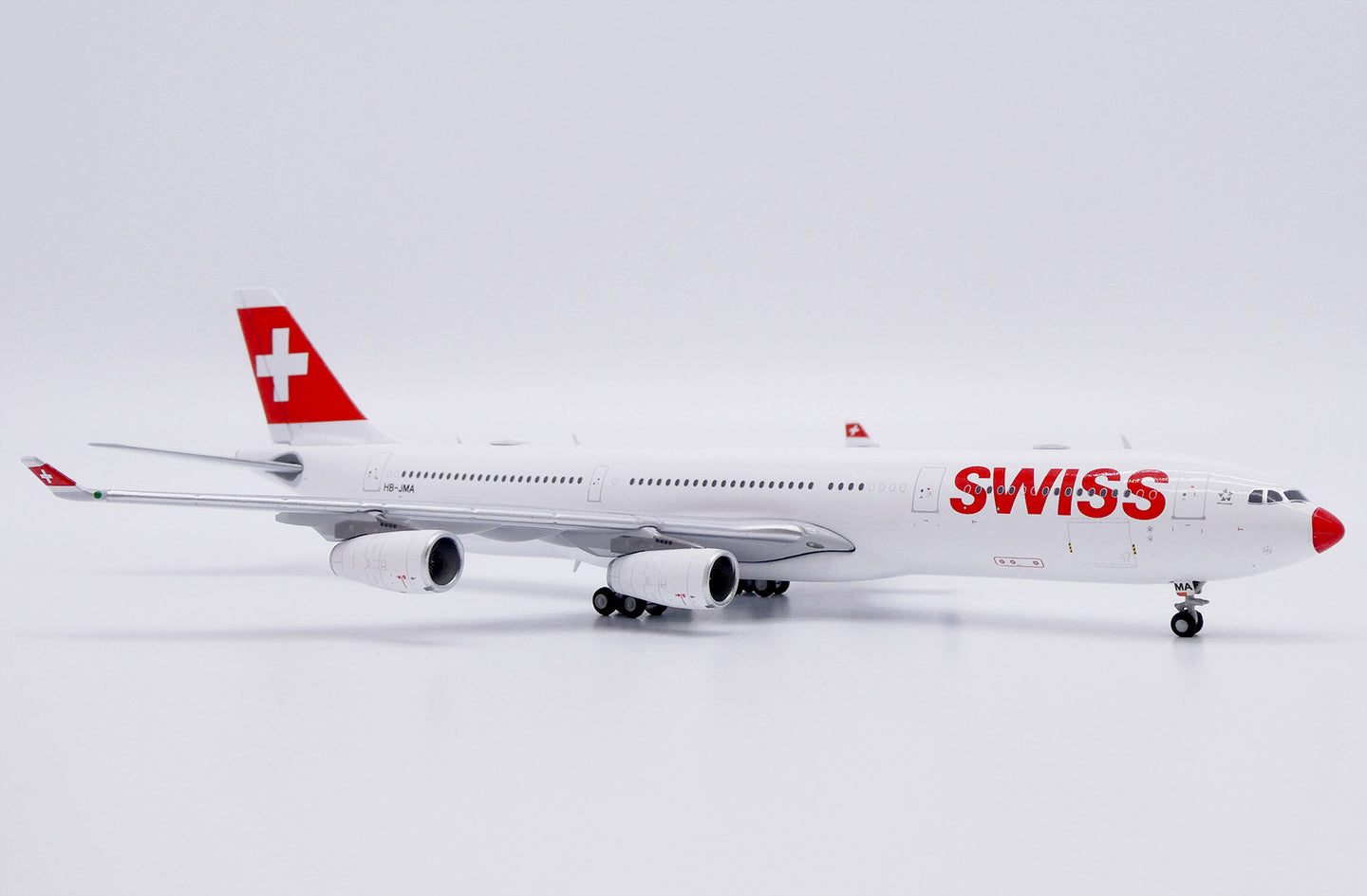 JC WINGS A340-300 SWISS "RED NOSE" REG: HB-JMA