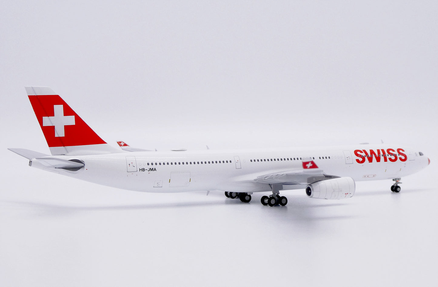 JC WINGS A340-300 SWISS "RED NOSE" REG: HB-JMA