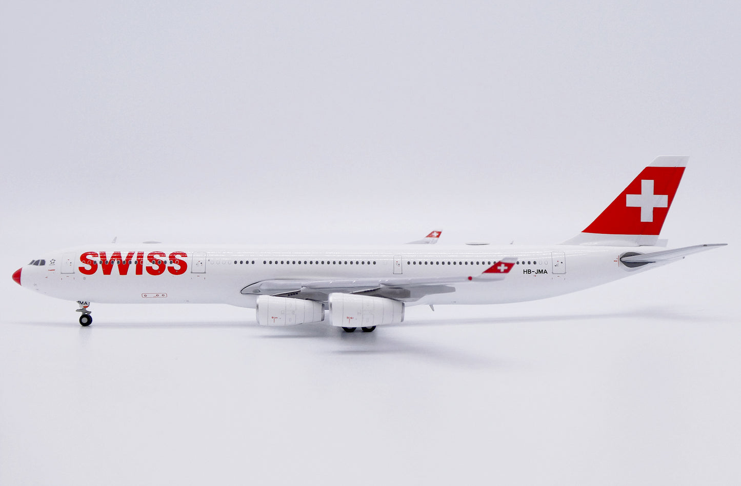 JC WINGS A340-300 SWISS "RED NOSE" REG: HB-JMA