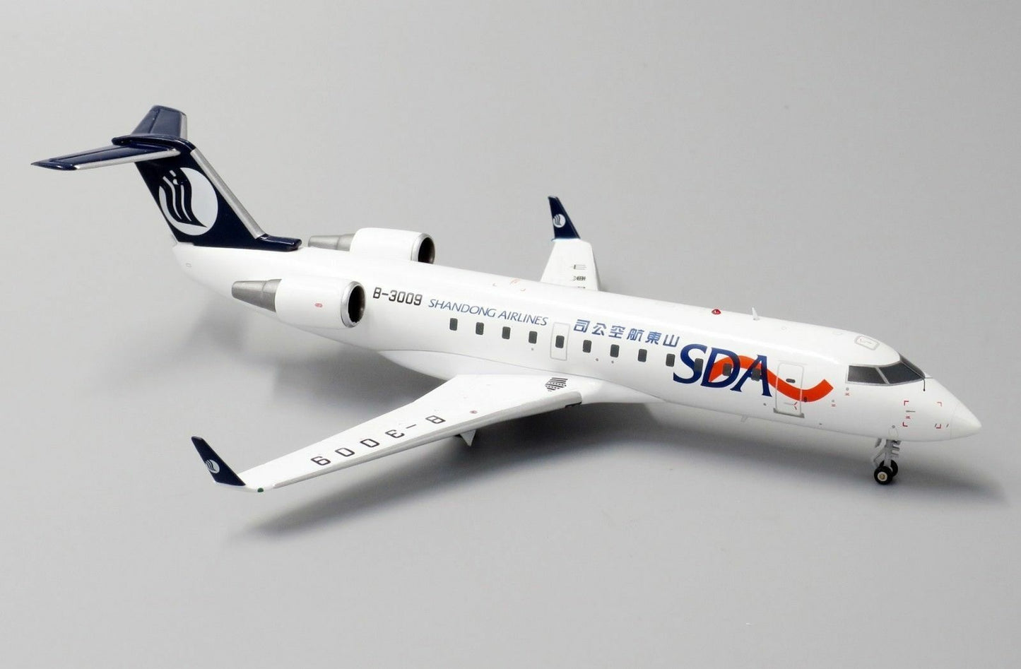 JC WINGS CRJ-200ER SHANDONG AIRLINES REG: B-3009 WITH STAND