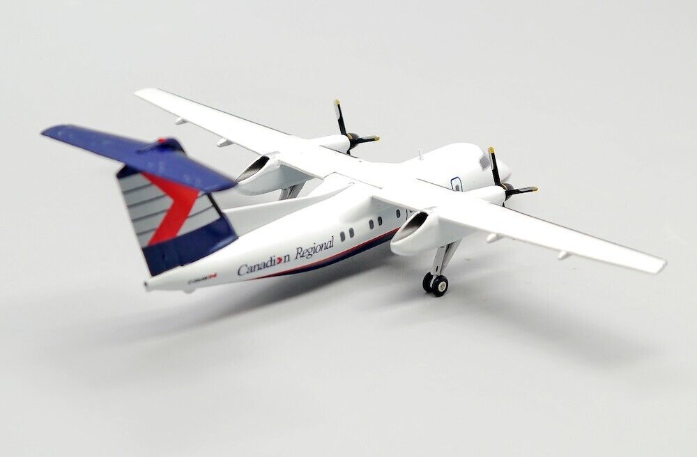 JCWINGS DASH 8-Q102 CRA REG: C-GAAM