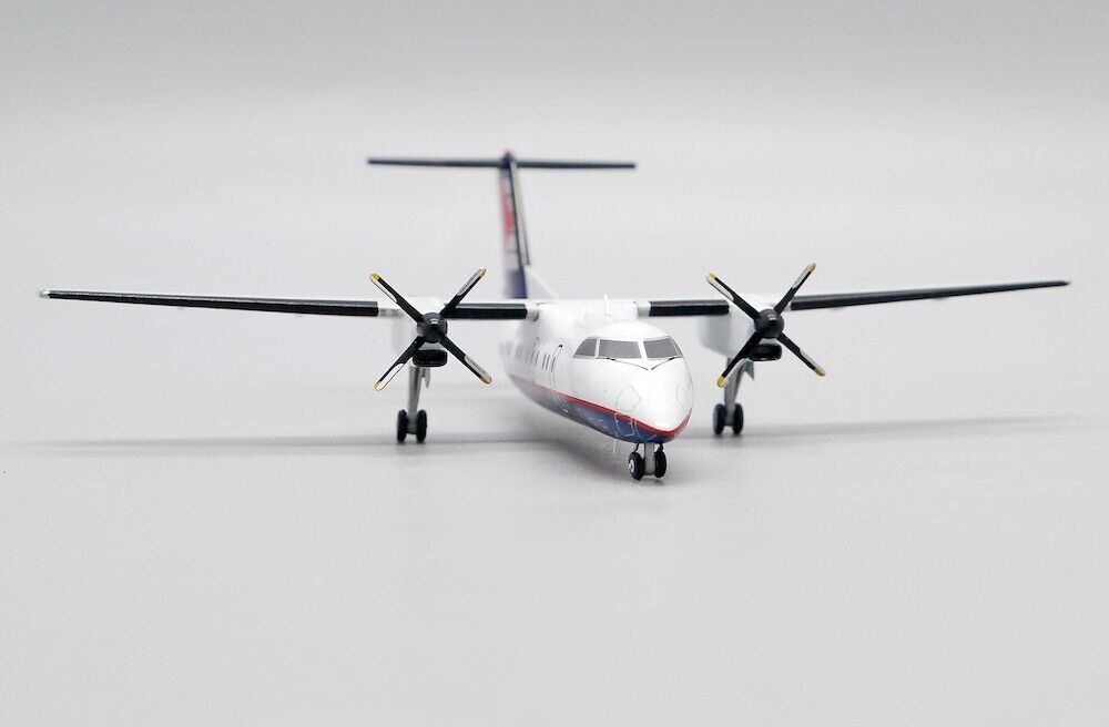 JCWINGS DASH 8-Q102 CRA REG: C-GAAM