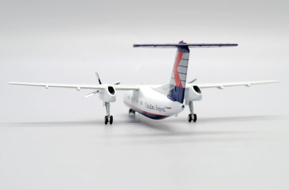 JCWINGS DASH 8-Q102 CRA REG: C-GAAM