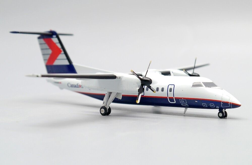 JCWINGS DASH 8-Q102 CRA REG: C-GAAM