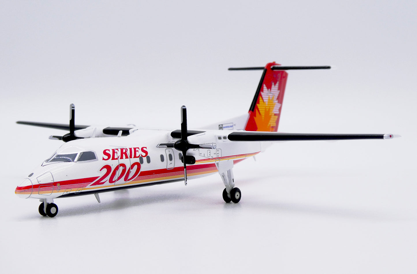 JC WINGS DASH 8-Q200 SERIES 200 HOUSE COLOUR REG: C-GGMP
