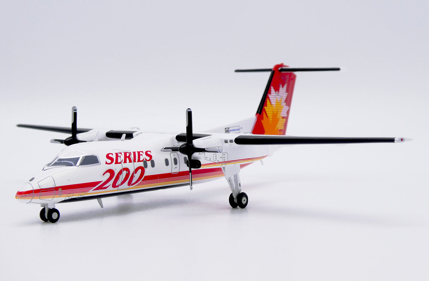JC WINGS DASH 8-Q200 SERIES 200 HOUSE COLOUR REG: C-GGMP