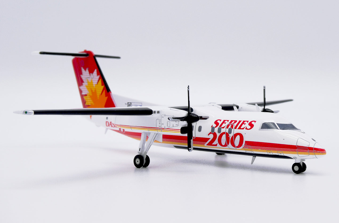 JC WINGS DASH 8-Q200 SERIES 200 HOUSE COLOUR REG: C-GGMP