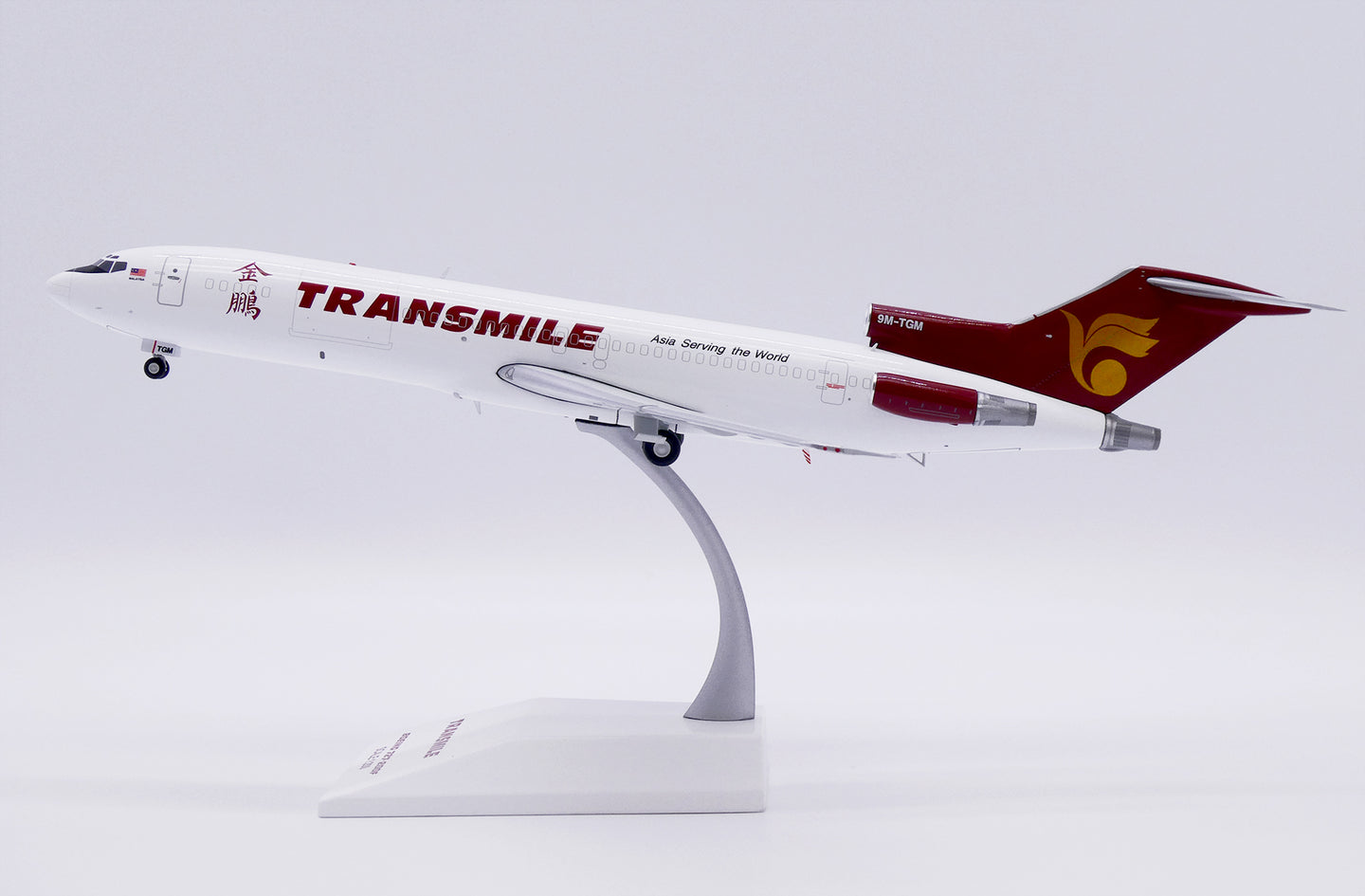 JCWINGS B727-200F(ADV) TRANSMILE AIR SERVICES REG: 9M-TGM