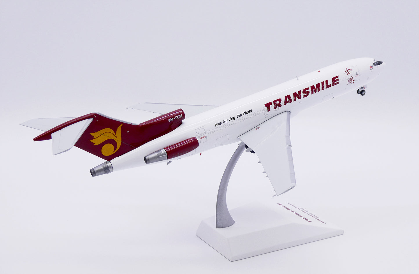JCWINGS B727-200F(ADV) TRANSMILE AIR SERVICES REG: 9M-TGM