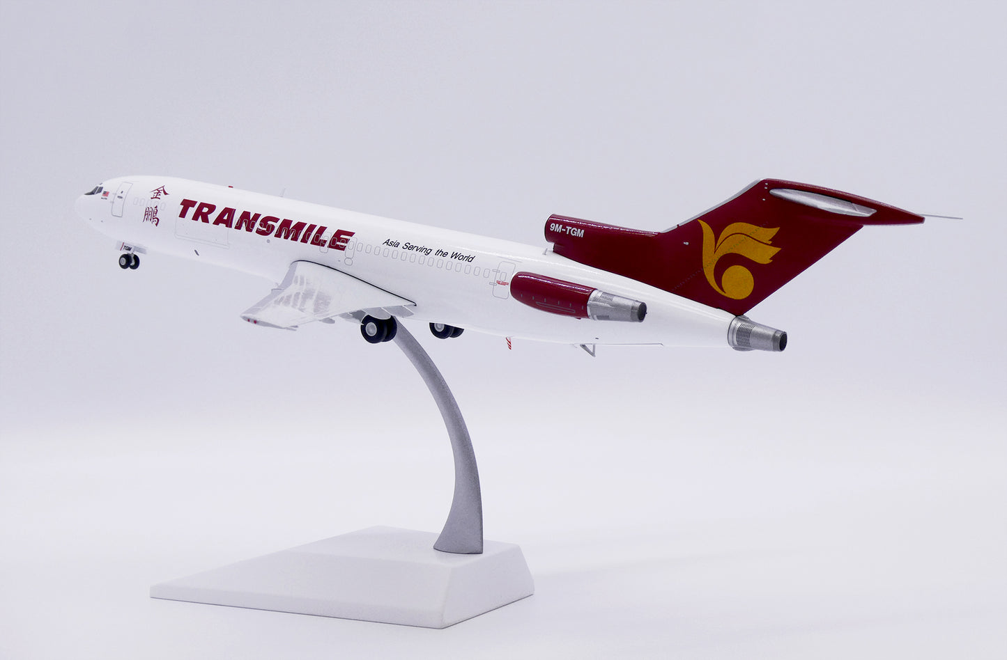 JCWINGS B727-200F(ADV) TRANSMILE AIR SERVICES REG: 9M-TGM