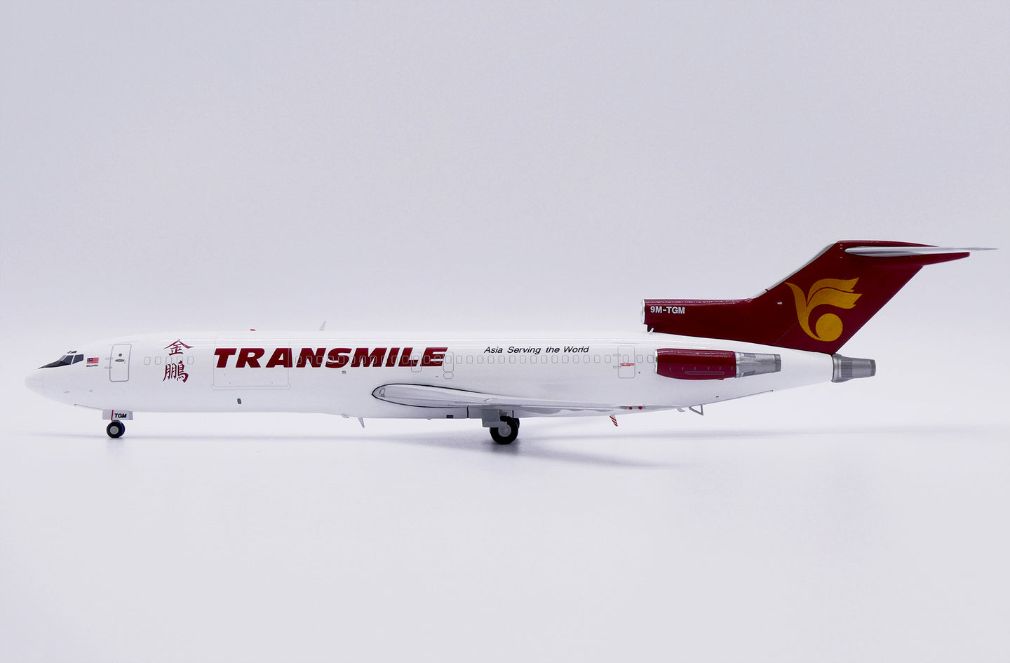 JCWINGS B727-200F(ADV) TRANSMILE AIR SERVICES REG: 9M-TGM