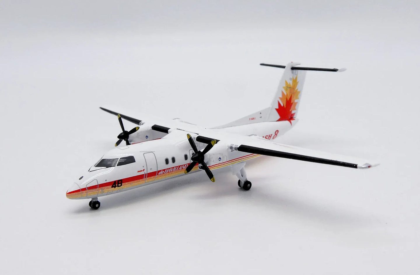 JC WINGS DASH 8-Q100 HOUSE COLOUR 48 REG: C-GGPJ