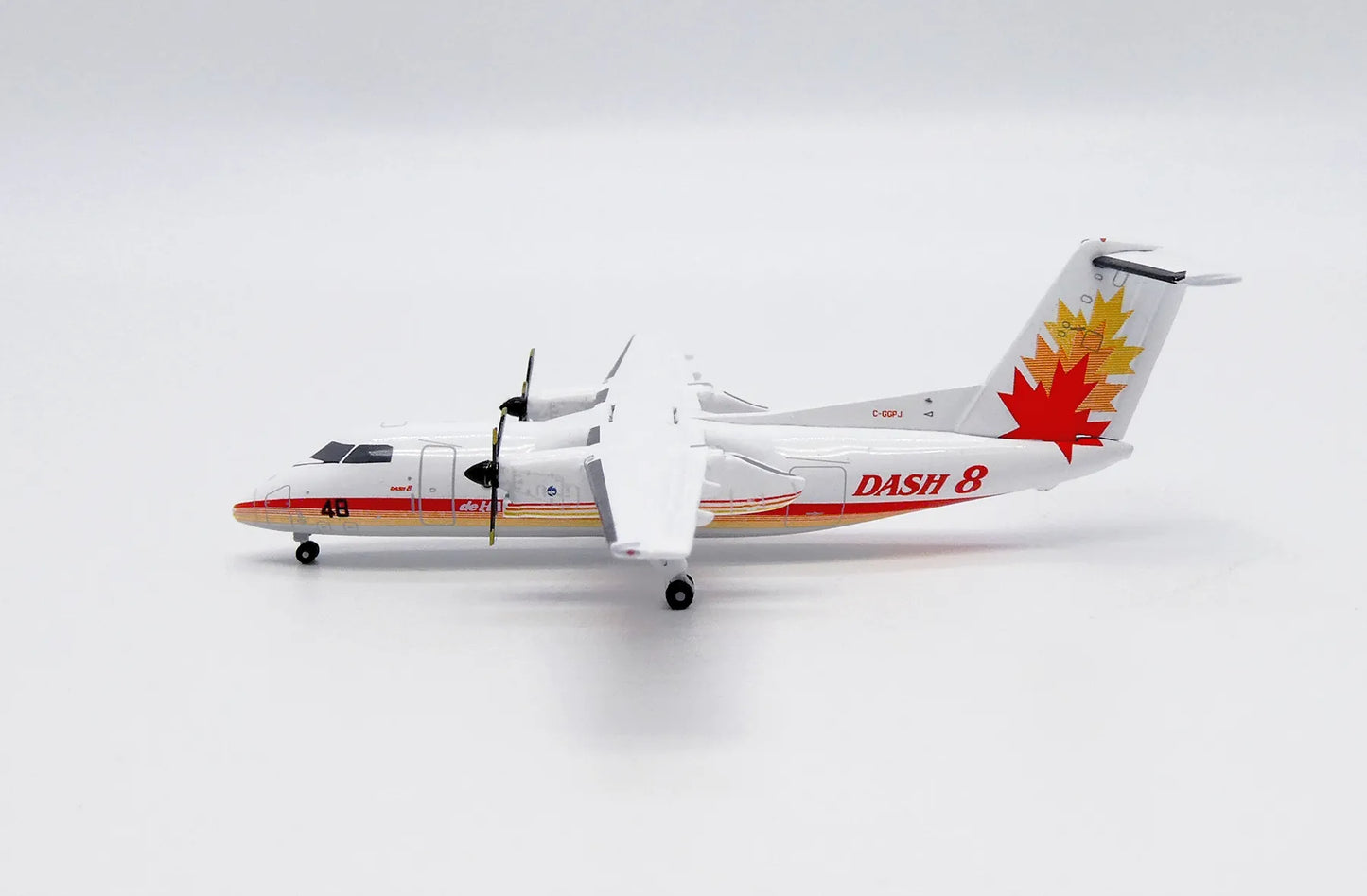 JC WINGS DASH 8-Q100 HOUSE COLOUR 48 REG: C-GGPJ