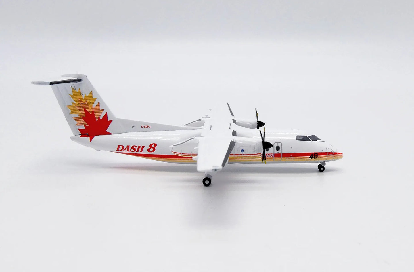 JC WINGS DASH 8-Q100 HOUSE COLOUR 48 REG: C-GGPJ